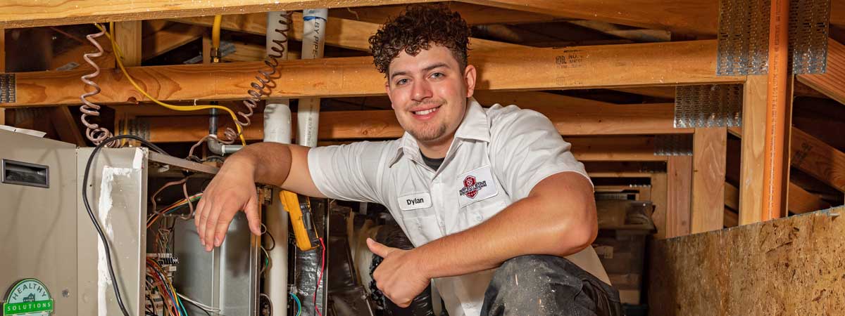 Furnace-in-Attic-Dylan-Doznelli-furnace-repair Senior Comfort Adviser, Danny Mendoza servicing a client’s furnace in Brentwood, CA